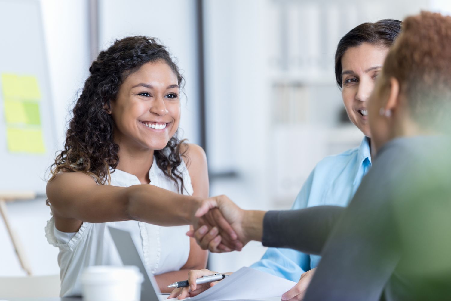 Professional handshake during a partnership meeting